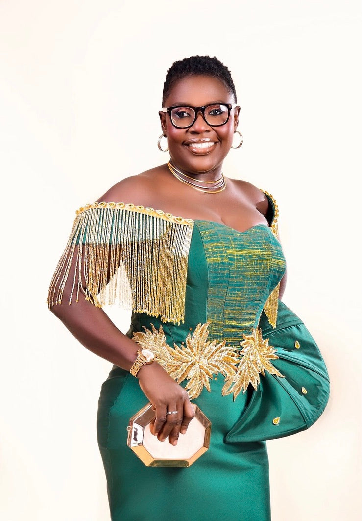 Zoba Martin's Mother in an emerald off-shoulder designer by Zoba Martin Green dress with gold bead fringe for her 50th birthday.
